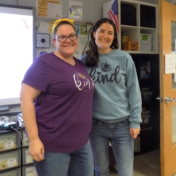 Picture of teachers Ms. Claypool and Ms. Krum, posing in their Bee Kind spirit shirts.