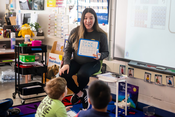 Kindergarten teacher leading the class. 