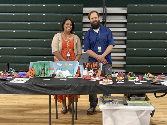 Ms. Patel and Mr. Kettler with student artwork 
