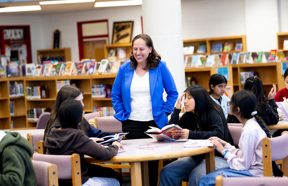 Principal Bromberg with students in the Liberty library