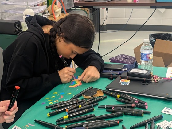 Nursing student designing a leather shoe