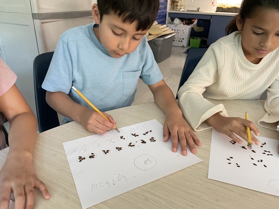 Third graders couting milkweed seeds