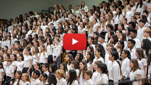 Screenshot of students in a choir performing