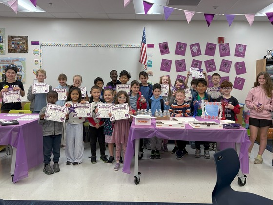 Military connected students holding certificates
