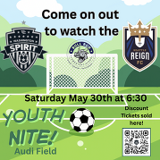 soccer field with a game being advertised