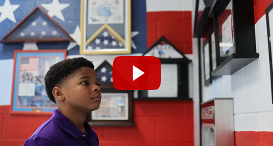 Boy looking at War memorabilia 