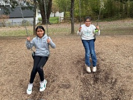 Two students on the swings