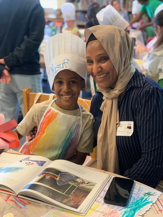 Mom and one of our proud Pandas wearing the handmade chefs hat and apron made to celebrating the Reading Restaurant.