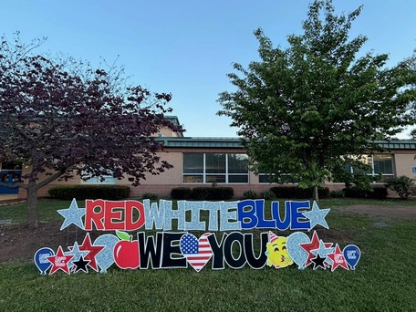 cardboard cutout sign with we love deer park in red white and blue