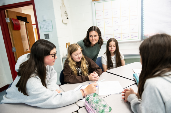Mrs. Suraci working with students in a classroom