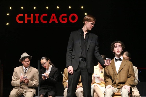 students performing on stage