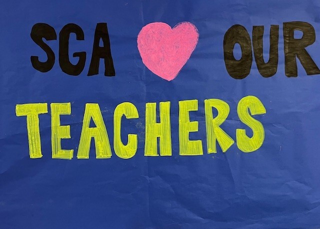 Blue banner with the words SGA heart our teachers
