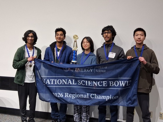 TJ's Science Bowl Team posing with regional championship banner last month