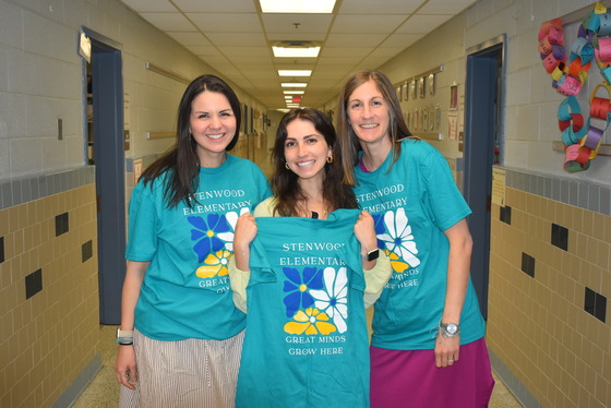 A picture of the 4th  grade team receiving their new Stenwood T-Shirts