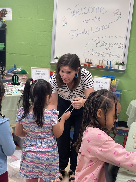 volunteer helping a student shop