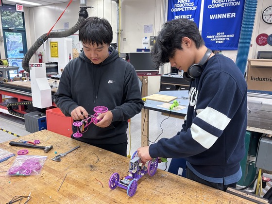 Engineering students making solar cars