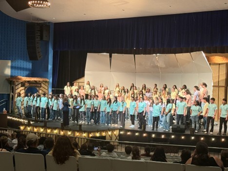 Students standing on a stage