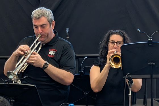 Mr LaBrie and Ms. Hall playing band instruments