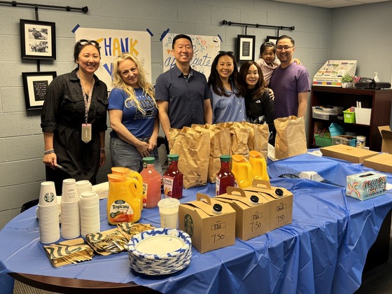 people from the church and school serving breakfast