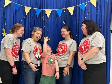 Student takes selfie at Special Olympics Banquet