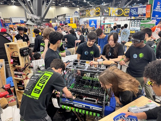 students working together at a robotics competition