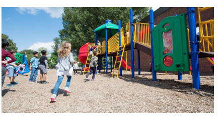 students running on playground 