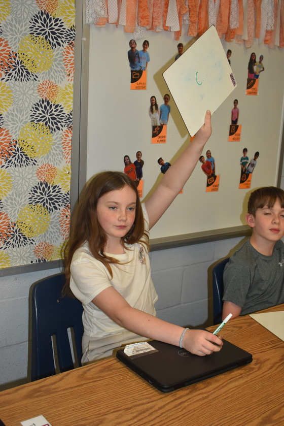 A prepared student showing her answer to a math SOL test prep question