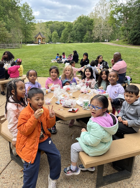 Students having a picnic lunch during their field trip to Wolf Trap theater this week.