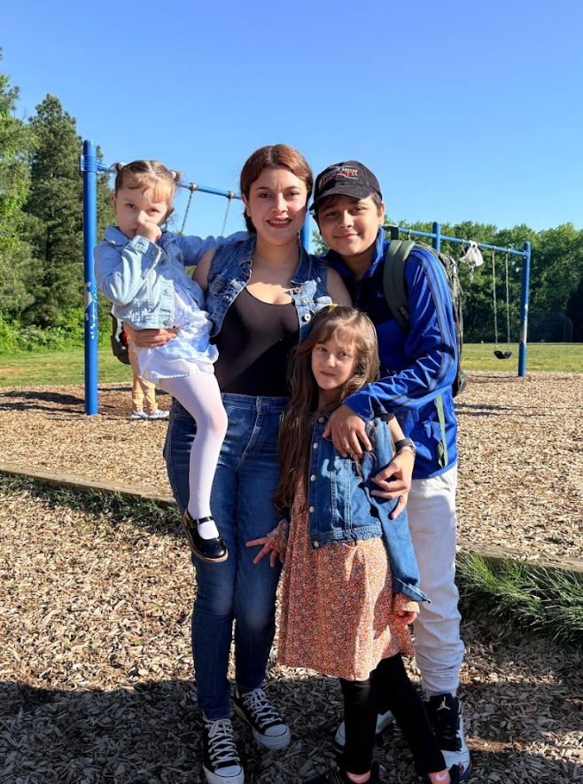 Students with their mom outside. 