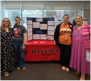 images of FCPS staff members in front of a tri-fold board