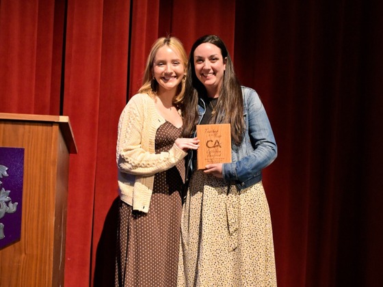 Mrs. Reinfried receives the Teacher of the Year award