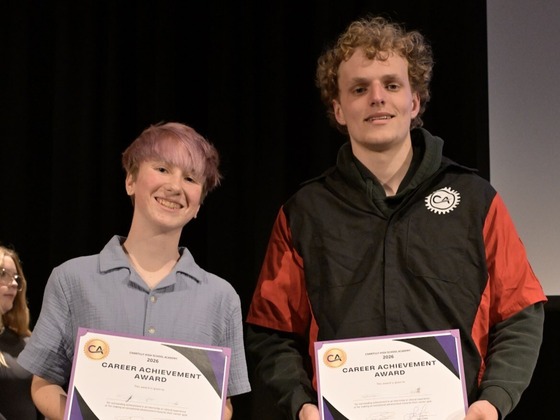 Student award recipients on stage