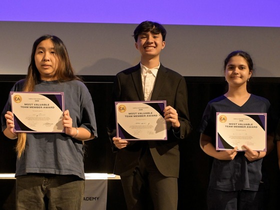 Student award recipients on stage
