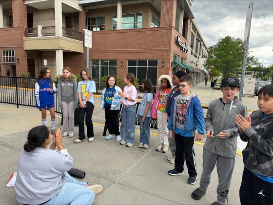 Students singing in front of Bruster's