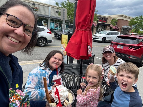 Staff members and families enjoying Bruster's Ice Cream