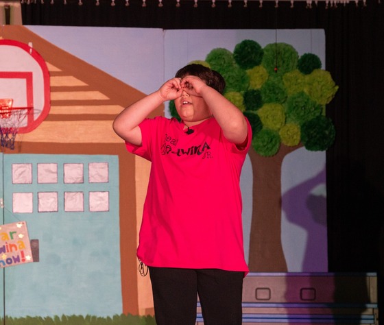 A member of the Dear Edwina Jr cast performing in the school production.