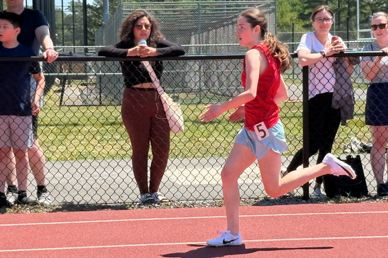 Liberty student running during a track meet