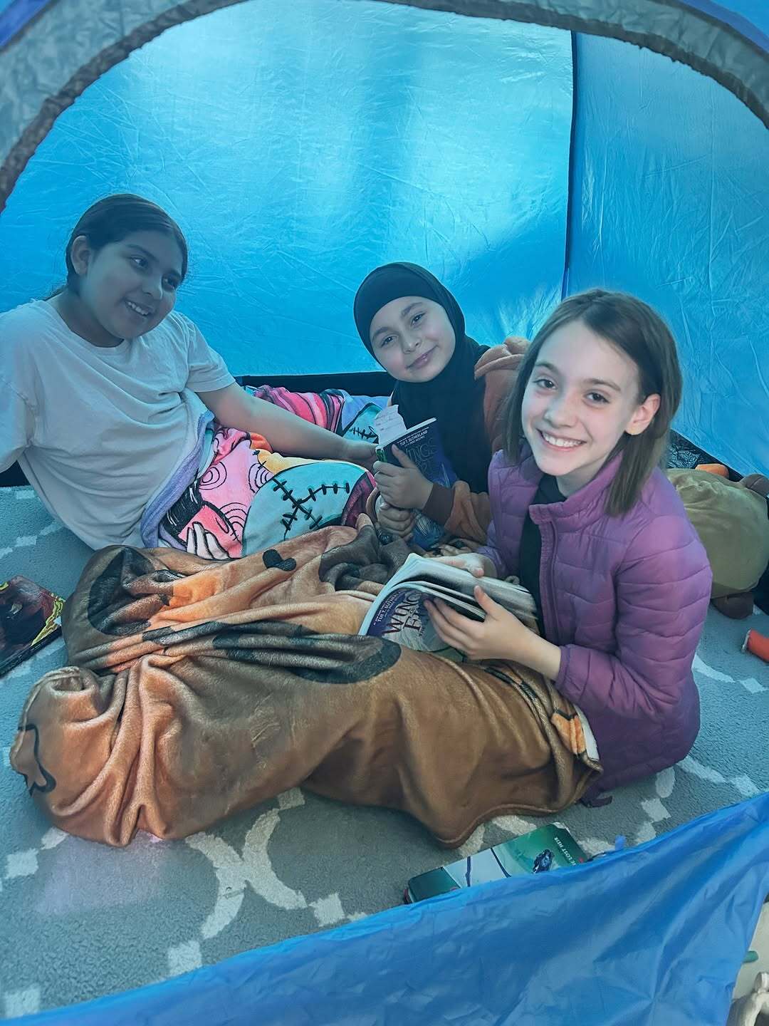 students in camping tent 