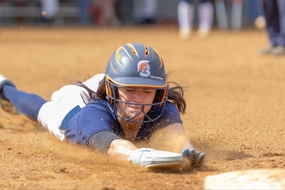 student playing softball