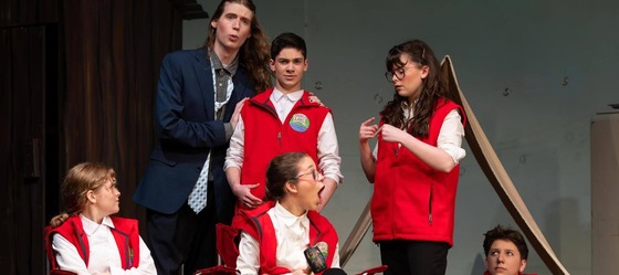 students performing on stage