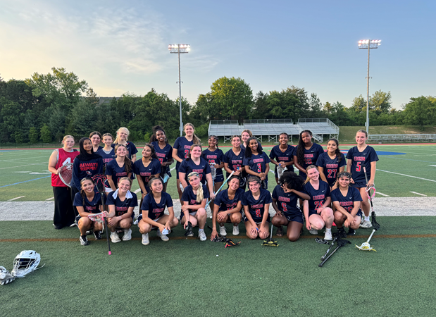 Girls lacrosse team on the field