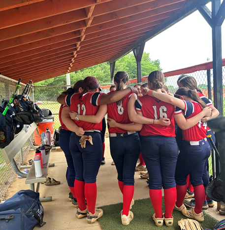 Girls softball team in the dugout