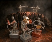 four metal art pieces of musicians