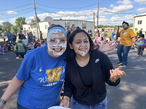Ms. Alexander and a student pose after the Rock, Paper, Scissors, Pie contest