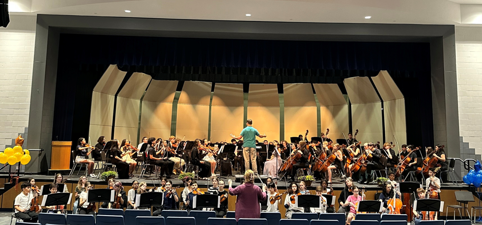 Orchestras playing together on stage