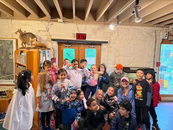 1st grade students in group photo on field trip