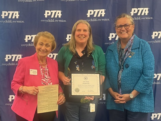 Image of Mrs. Brooker and PTA Award