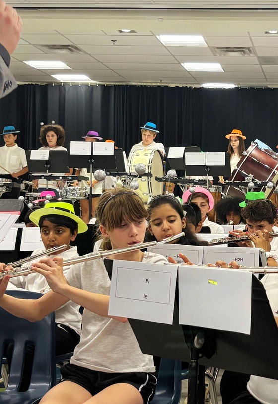 Students in hats playing band instruments