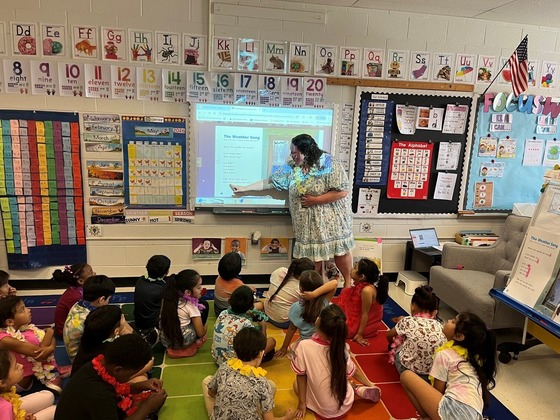 Kindergarten teacher in her classroom with students