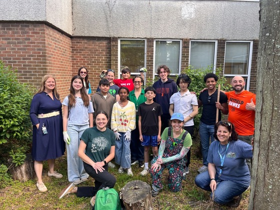 Get2Green image shows HES Principal Dr. TM and HSS Principal Mr. DiBari with students on Green Teams.